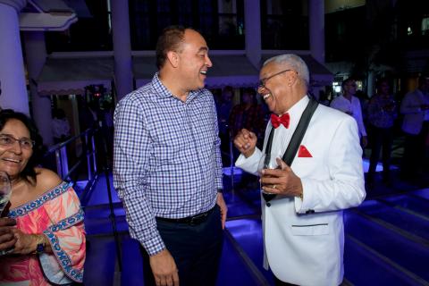 Health Minister Dr Christopher Tufton (left) and CEO of Advanced Integrated Systems Doug Halsall greet each other with a handshake during a social event.